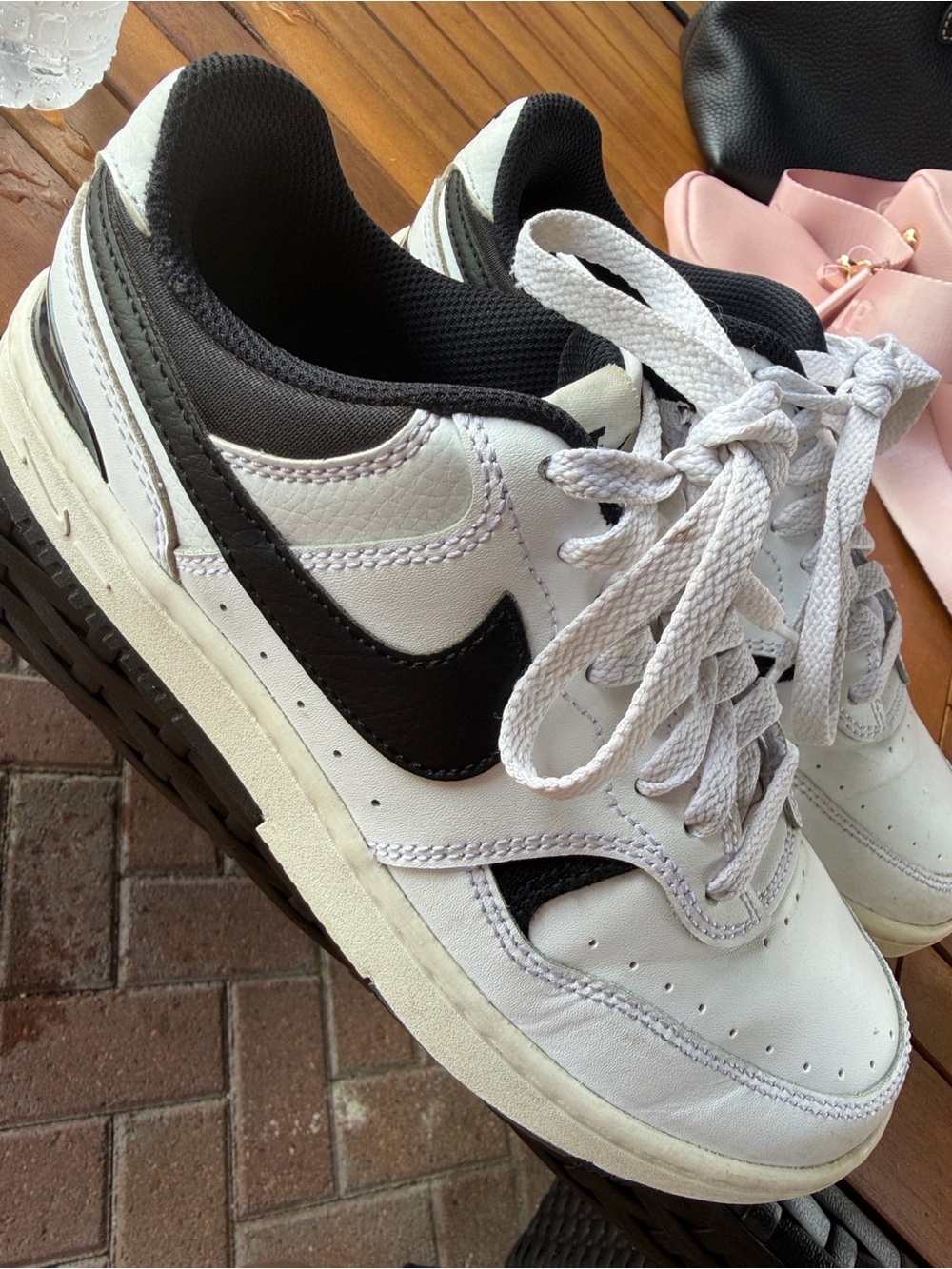 Nike White and Black Low-Top Sneakers with Classic Swoosh